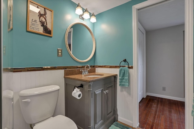 1859 State Route 257 N, Ostrander, OH 43061 - bathroom featuring vanity, hardwood / wood-style floors, and wainscoting