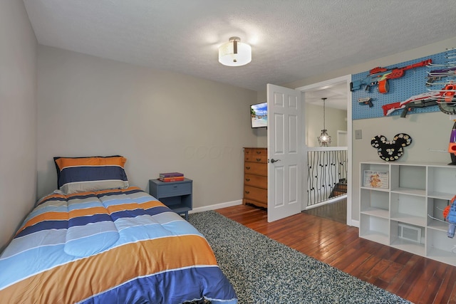 1859 State Route 257 N, Ostrander, OH 43061 - bedroom with hardwood / wood-style flooring and a textured ceiling