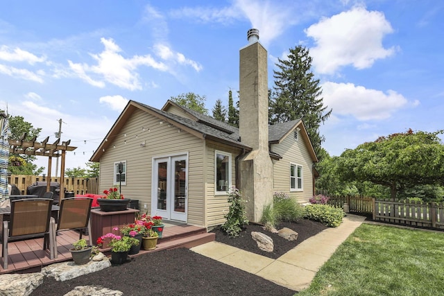 1859 State Route 257 N, Ostrander, OH 43061 - rear view of house featuring a deck, a pergola, a chimney, and french doors