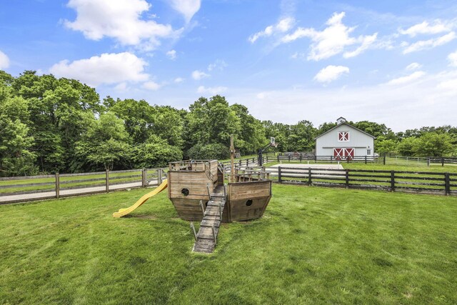1859 State Route 257 N, Ostrander, OH 43061 - view of yard featuring a barn, an outdoor structure, a view of countryside, and a playground