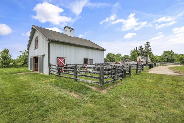 1859 State Route 257 N, Ostrander, OH 43061 - view of property exterior with an outbuilding, an exterior structure, roof with shingles, and a chimney