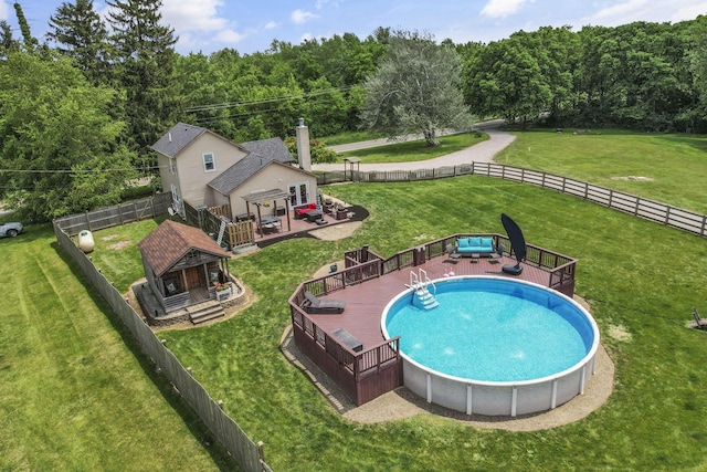 1859 State Route 257 N, Ostrander, OH 43061 - view of pool featuring a deck, a fenced backyard, and a forest view