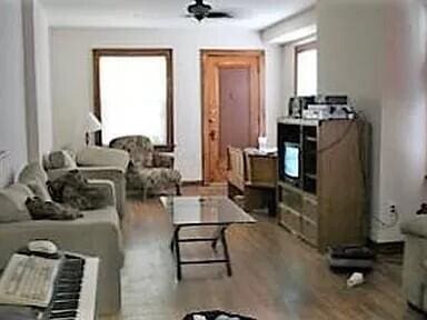 384 E 17th Ave, Columbus, OH 43201 - living room with wood finished floors and a ceiling fan