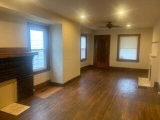 384 E 17th Ave, Columbus, OH 43201 - unfurnished living room with a fireplace, baseboards, a ceiling fan, dark wood finished floors, and recessed lighting