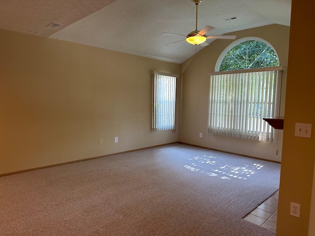 2328 Willowside Ln, Grove City, OH 43123 - unfurnished room with healthy amount of natural light, ceiling fan, light carpet, lofted ceiling, and a textured ceiling