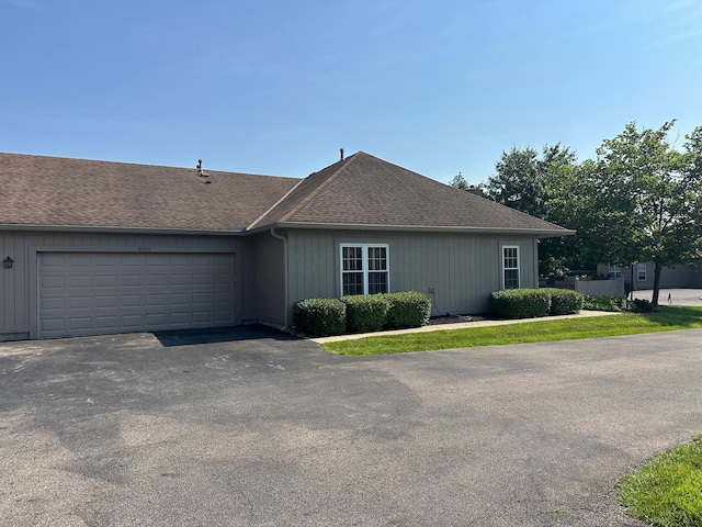 2328 Willowside Ln, Grove City, OH 43123 - ranch-style house with driveway, an attached garage, and roof with shingles