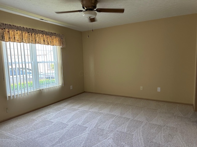2328 Willowside Ln, Grove City, OH 43123 - empty room with a textured ceiling, light colored carpet, and a ceiling fan