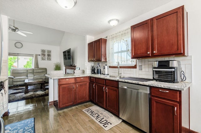 729 Lilly Landing Ln, Blacklick, OH 43004 - kitchen featuring dishwasher, a peninsula, reddish brown cabinets, vaulted ceiling, and ceiling fan