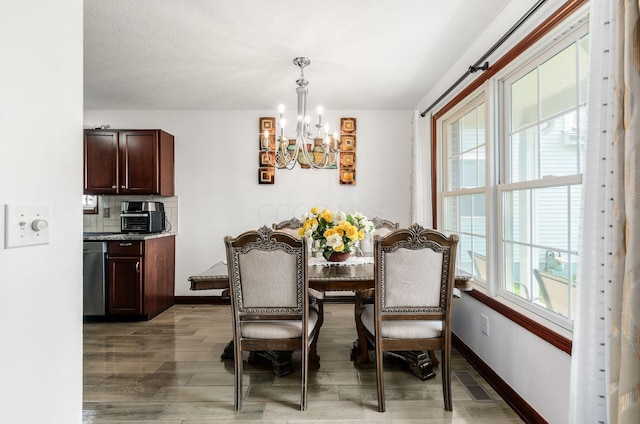 729 Lilly Landing Ln, Blacklick, OH 43004 - dining area featuring a chandelier and light wood-style floors