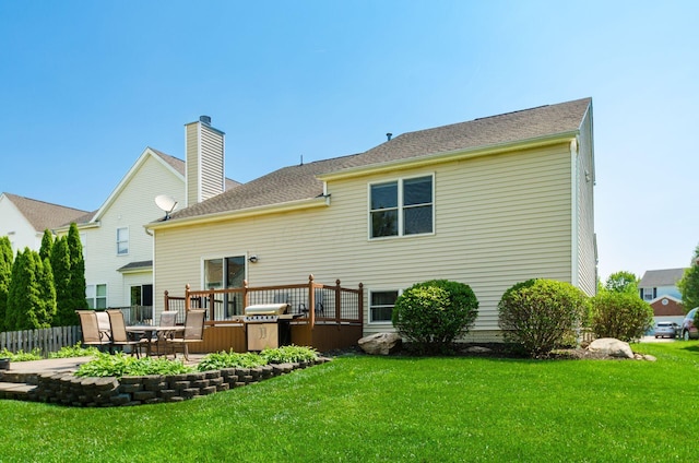 729 Lilly Landing Ln, Blacklick, OH 43004 - back of property featuring a yard, a chimney, a patio area, and a deck