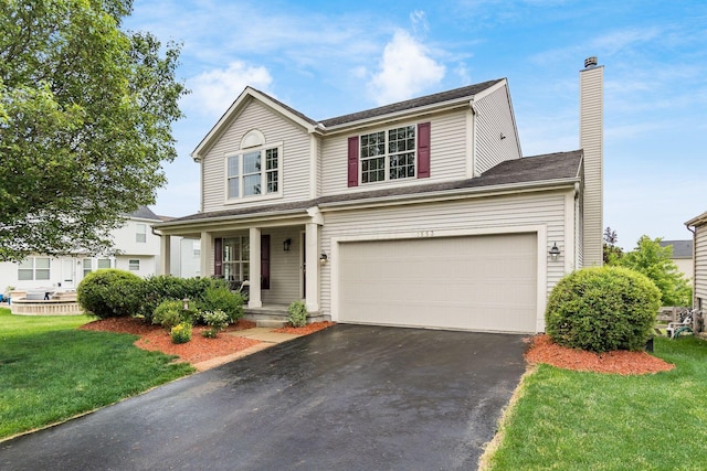 1553 Grove Hill Dr, Columbus, OH 43240 - traditional-style house featuring asphalt driveway, covered porch, a front yard, a chimney, and a garage