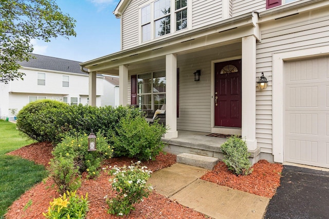 1553 Grove Hill Dr, Columbus, OH 43240 - view of exterior entry featuring a porch and a garage