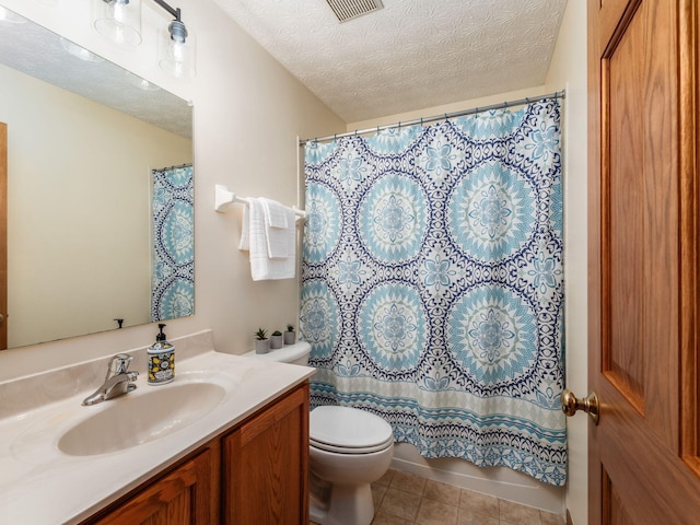 1553 Grove Hill Dr, Columbus, OH 43240 - bathroom with vanity, a textured ceiling, and tile patterned floors