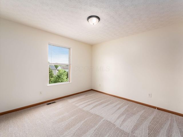 1553 Grove Hill Dr, Columbus, OH 43240 - carpeted empty room featuring baseboards and a textured ceiling