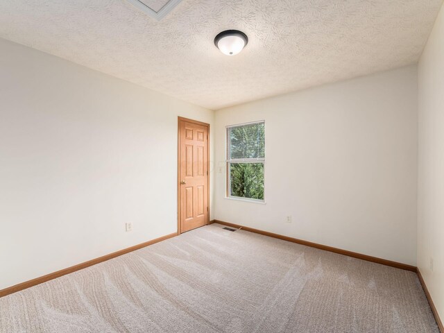 1553 Grove Hill Dr, Columbus, OH 43240 - unfurnished room featuring carpet and a textured ceiling