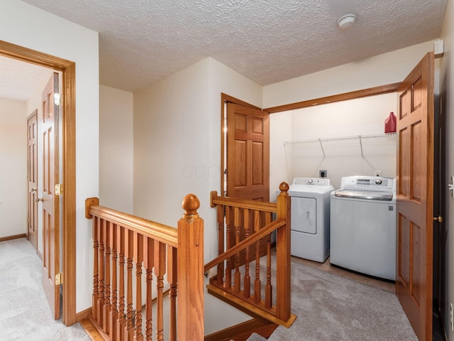 1553 Grove Hill Dr, Columbus, OH 43240 - washroom featuring washing machine and dryer, light carpet, and a textured ceiling