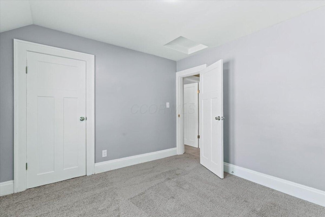 364 Clarendon Ave, Columbus, OH 43223 - unfurnished bedroom with carpet floors and lofted ceiling
