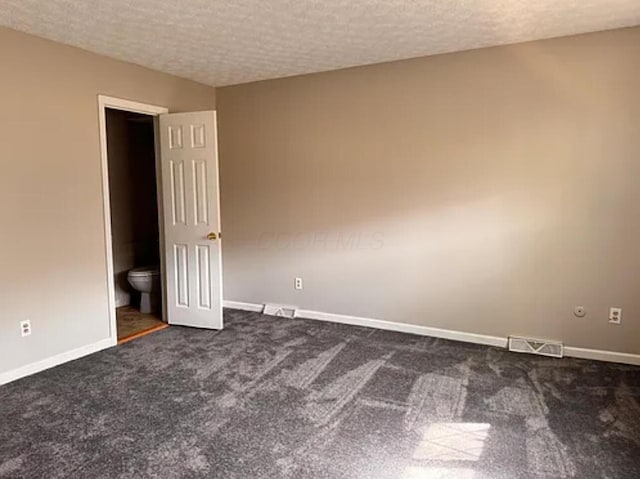 991 Hidden Acres Ct, Columbus, OH 43224 - spare room featuring dark carpet and a textured ceiling