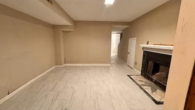 991 Hidden Acres Ct, Columbus, OH 43224 - unfurnished living room featuring a fireplace with flush hearth and baseboards