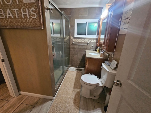 45 Shady Ln Unit 552On, Waverly, OH 45690 - bathroom with tile walls, vanity, a shower stall, and wood finished floors