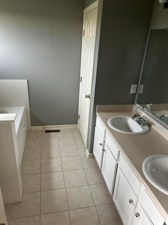 1021 Taylor Glen Blvd E, Pataskala, OH 43062 - bathroom featuring double vanity, tile patterned flooring, and a tub to relax in