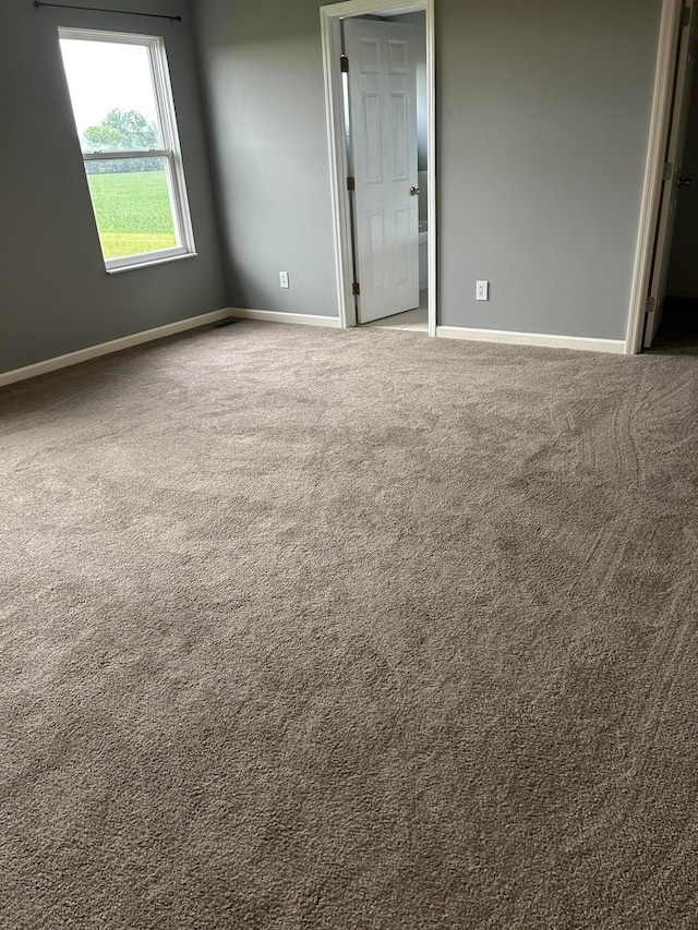 1021 Taylor Glen Blvd E, Pataskala, OH 43062 - spare room featuring carpet floors and baseboards