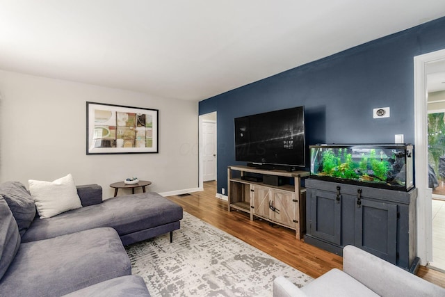 3064 Melva Ave, Columbus, OH 43224 - living area featuring wood finished floors and baseboards