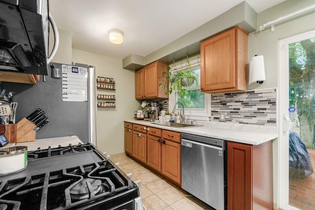 3064 Melva Ave, Columbus, OH 43224 - kitchen featuring stainless steel dishwasher, black gas stove, tasteful backsplash, and light countertops