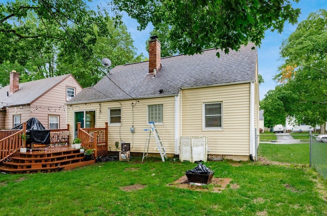3064 Melva Ave, Columbus, OH 43224 - rear view of house with an outdoor fire pit, a deck, a chimney, and a shingled roof