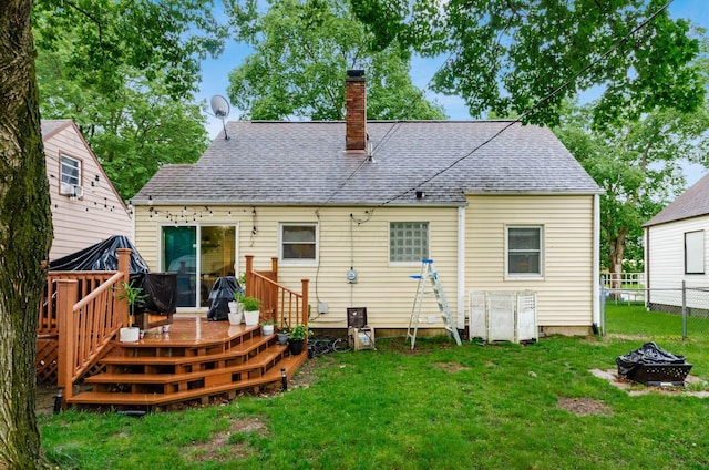 3064 Melva Ave, Columbus, OH 43224 - rear view of property with a fire pit, a deck, a chimney, and a shingled roof