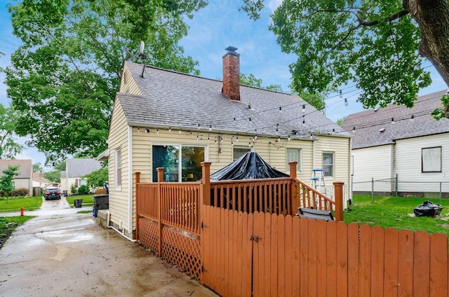 3064 Melva Ave, Columbus, OH 43224 - back of house featuring a chimney and a shingled roof