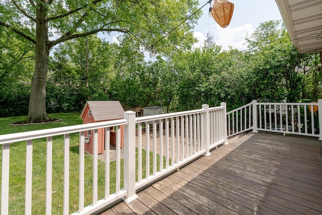 98 N Chesterfield Rd, Columbus, OH 43209 - wooden deck with a shed, a lawn, and view of wooded area