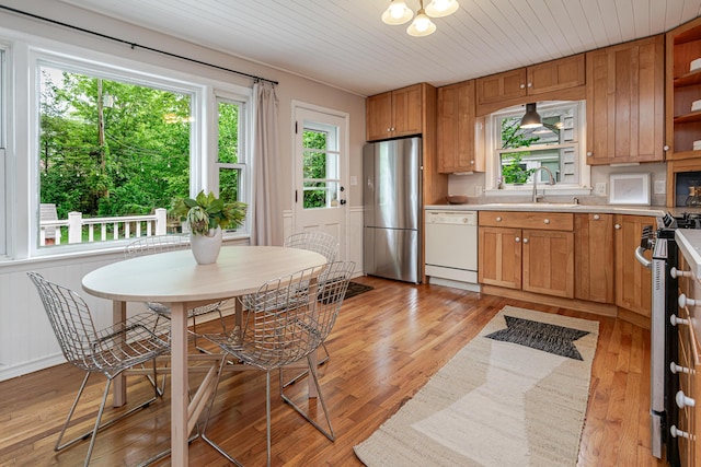 98 N Chesterfield Rd, Columbus, OH 43209 - kitchen featuring freestanding refrigerator, white dishwasher, light countertops, open shelves, and light wood-style flooring