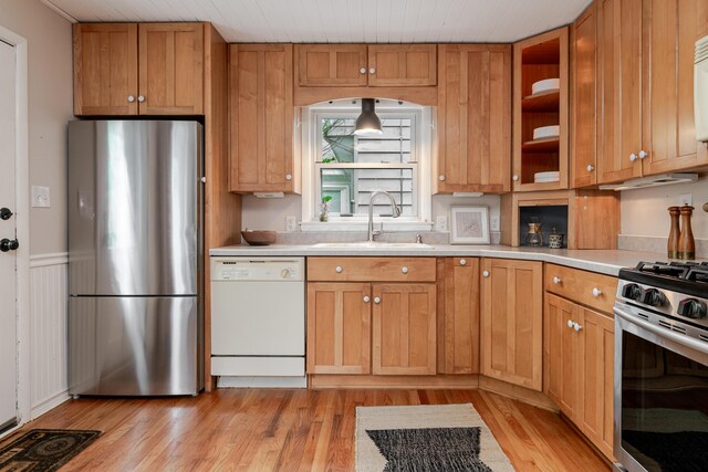 98 N Chesterfield Rd, Columbus, OH 43209 - kitchen with stainless steel appliances, light wood-style flooring, light countertops, open shelves, and a wainscoted wall