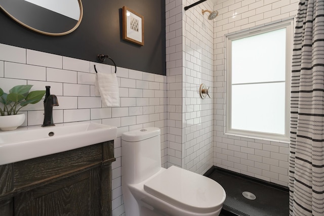 98 N Chesterfield Rd, Columbus, OH 43209 - bathroom featuring tiled shower, tile walls, and vanity