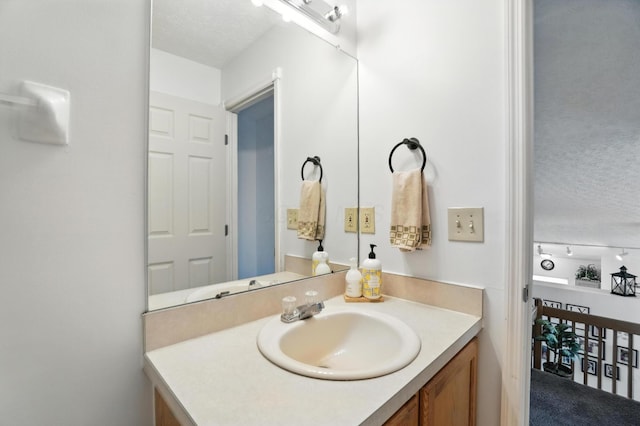 906 Linkfield Dr, Columbus, OH 43085 - bathroom featuring vanity and a textured ceiling