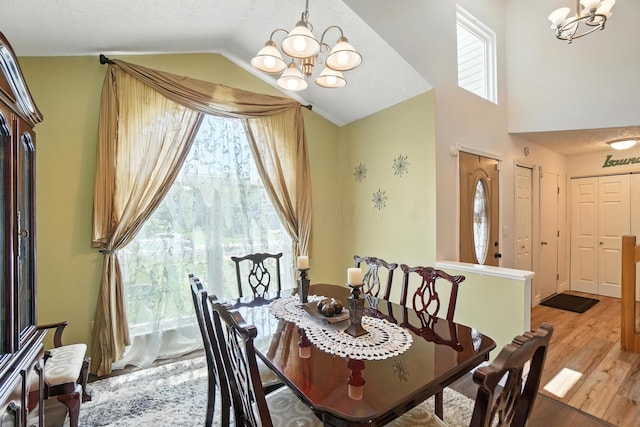 906 Linkfield Dr, Columbus, OH 43085 - dining room featuring a chandelier, wood finished floors, and lofted ceiling