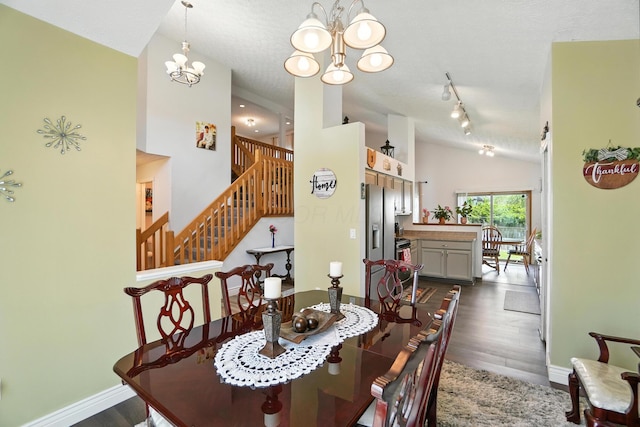 906 Linkfield Dr, Columbus, OH 43085 - dining room featuring vaulted ceiling, a chandelier, dark wood finished floors, and stairs
