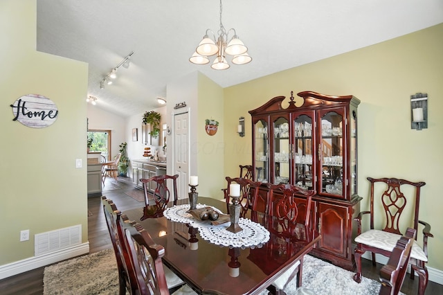 906 Linkfield Dr, Columbus, OH 43085 - dining space with lofted ceiling, a chandelier, dark wood-style flooring, and track lighting