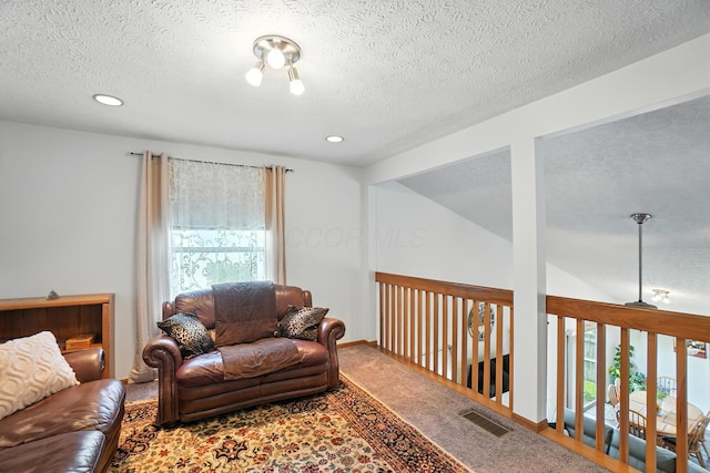 906 Linkfield Dr, Columbus, OH 43085 - living room with a textured ceiling, carpet, and recessed lighting