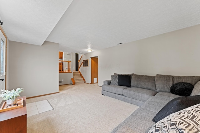 3550 Whisper Creek Dr, Columbus, OH 43231 - carpeted living area featuring stairway and a textured ceiling