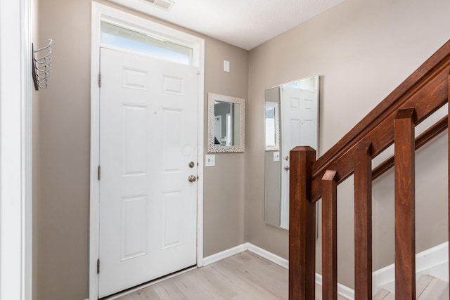 5588 Bow Falls Blvd Unit 35-558, Dublin, OH 43016 - foyer entrance featuring light wood-type flooring and baseboards