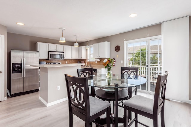 5588 Bow Falls Blvd Unit 35-558, Dublin, OH 43016 - dining room featuring light wood-style floors and recessed lighting