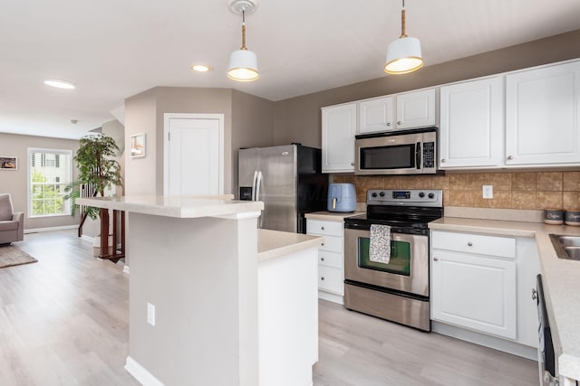 5588 Bow Falls Blvd Unit 35-558, Dublin, OH 43016 - kitchen featuring stainless steel appliances, light wood-style floors, backsplash, light countertops, and recessed lighting