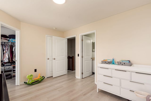 5588 Bow Falls Blvd Unit 35-558, Dublin, OH 43016 - bedroom featuring light wood-style floors and multiple closets