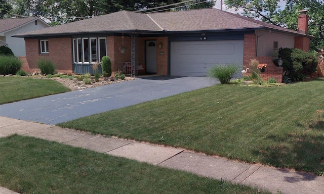 1618 Arrowood Loop N, Columbus, OH 43229 - single story home with brick siding, an attached garage, concrete driveway, a front lawn, and a chimney