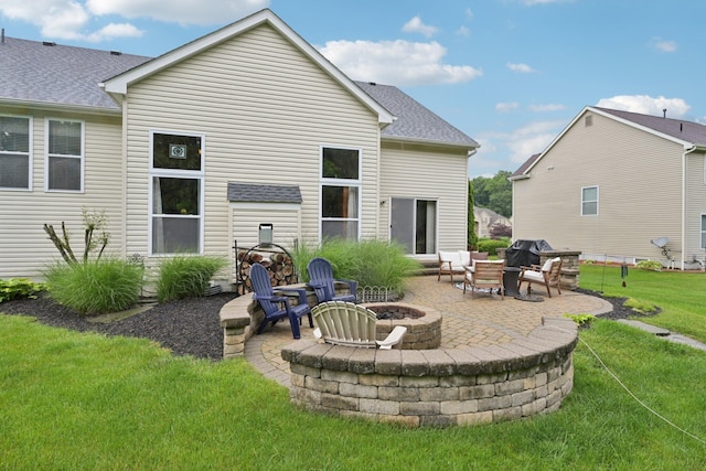 13946 Bainwick Dr NW, Pickerington, OH 43147 - rear view of property featuring an outdoor fire pit, a patio, a yard, and roof with shingles