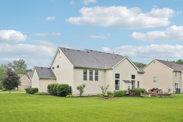 13946 Bainwick Dr NW, Pickerington, OH 43147 - back of property with a lawn and a shingled roof