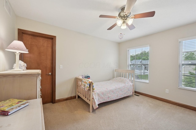 13946 Bainwick Dr NW, Pickerington, OH 43147 - bedroom featuring light colored carpet, multiple windows, and ceiling fan