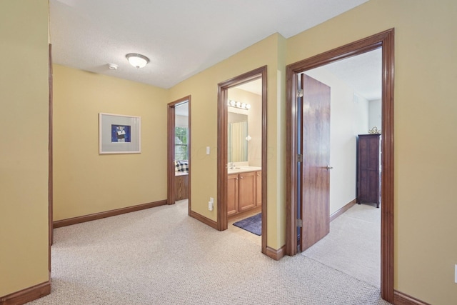 13946 Bainwick Dr NW, Pickerington, OH 43147 - corridor with light colored carpet and baseboards